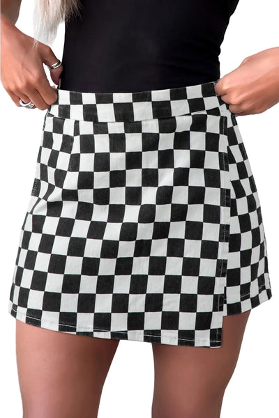 Model wearing black and white checker print cotton twill mini skort with pockets. Shown from front