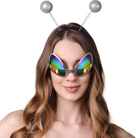 Person wearing colorful sunglasses and a headband with silver spherical ends on a white background