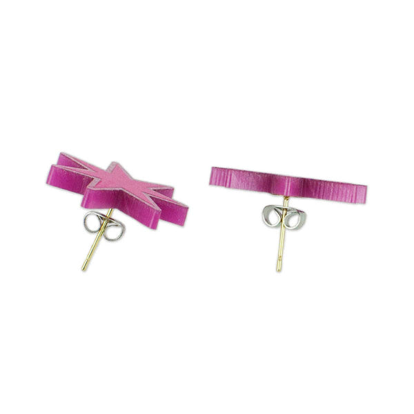 magenta laser-cut acrylic starburst post earrings with a matching glitter border. Shown from side