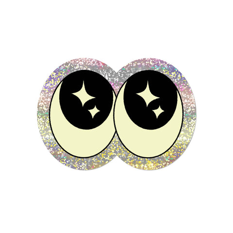 Die-cut holographic vinyl sticker of pair of cartoony eyes with starry pupils