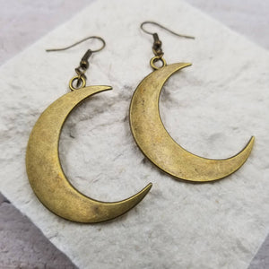 Burnished gold metal crescent moon dangle earrings 