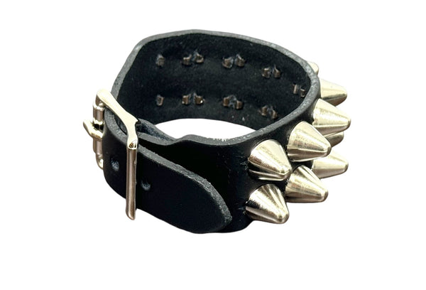2 row English cone studded black leather cuff with silver metal buckle. Shown closed from side to display buckle