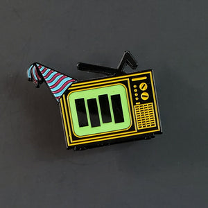 "TV Party" yellow enameled black metal 1 3/4" pin with digital print & epoxy tv screen effect, striped party hat
