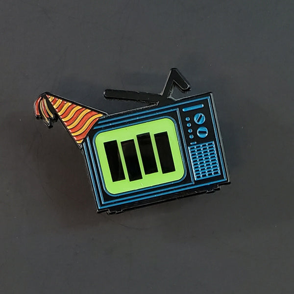 "TV Party" blue enameled black metal 1 3/4" pin with digital print & epoxy tv screen effect, striped party hat