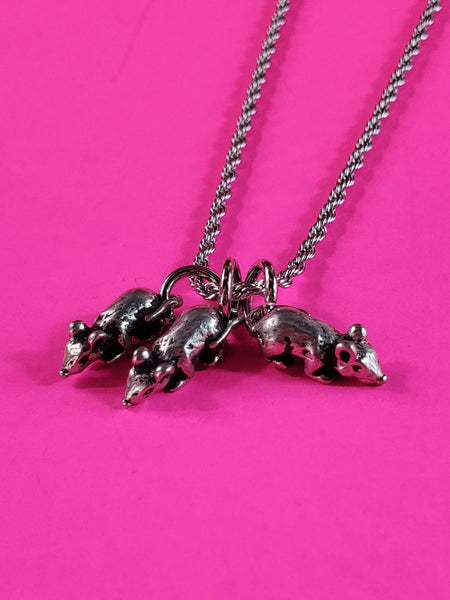 Three small American pewter charms in the shape of a rat hanging from a stainless steel rope chain