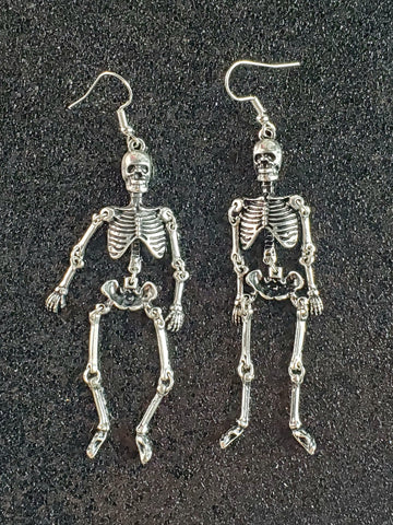 Silver metal skeleton dangle earrings with joints connected with o rings for movement
