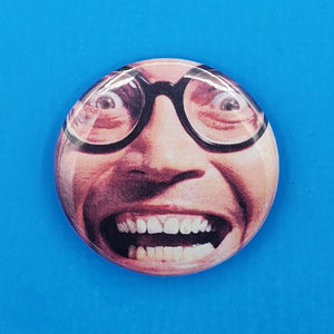 A 2.25" pinback button with a color image of a glasses-wearing man with a crazed, surprised look on his face