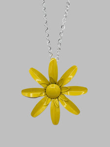 vintage-inspired metal daisy pendant in a shade of bright yellow on a 28” long shiny silver metal link chain