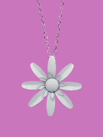 vintage-inspired metal daisy pendant in bright white on a 28” long shiny silver metal link chain