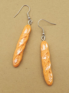 Dangle earrings with acrylic charms of loaves of baguette bread