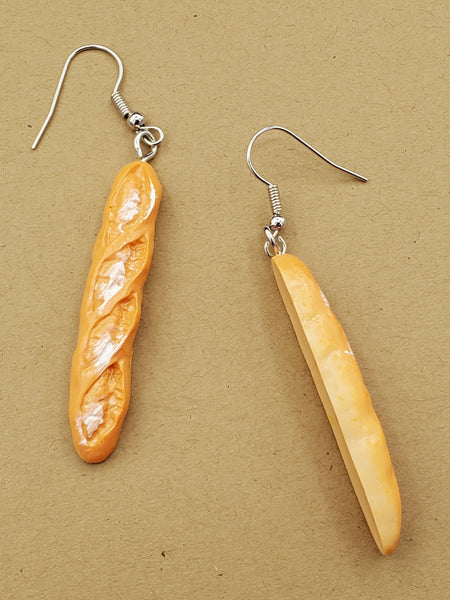 Dangle earrings with acrylic charms of loaves of baguette bread