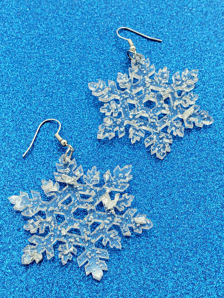 pair Transparent acrylic with silver glitter laser-cut snowflake-shaped dangle earrings