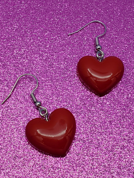 pair of red acrylic puffy heart dangle earrings