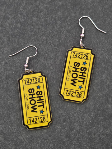 Yellow ticket shaped acrylic earrings with SHIT SHOW ADMIT ONE lettering in black