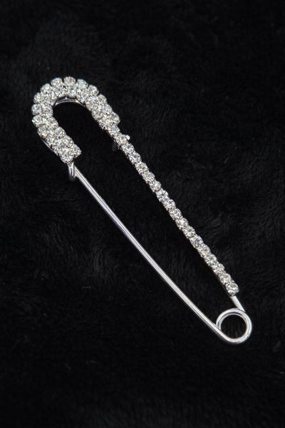 silver metal safety pin with clear "rhinestone" jewels