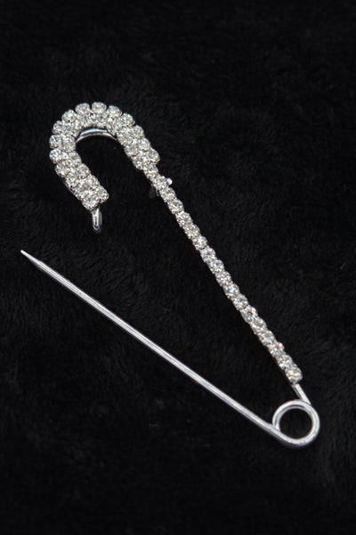 silver metal safety pin with clear "rhinestone" jewels