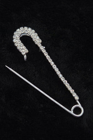 silver metal safety pin with clear "rhinestone" jewels