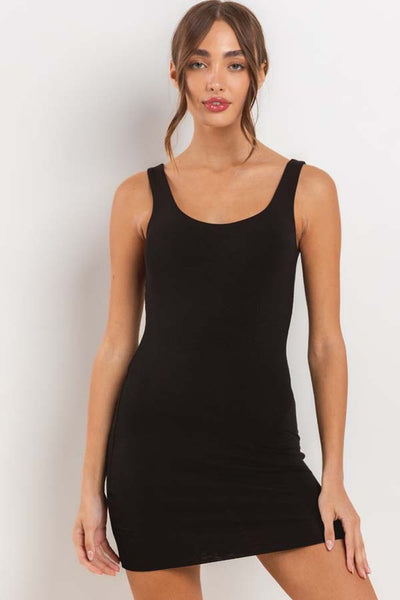 Model wearing brushed fiber knit tank mini dress with double lining and rounded scoop neckline. Shown from front
