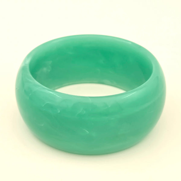 wide jade green resin bangle with subtle green and white marbling