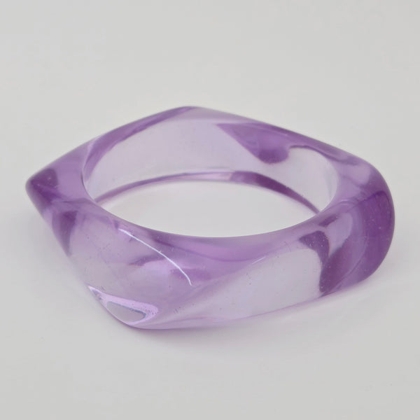 shiny irregularly square shaped resin bangle in a vibrant shade of light purple