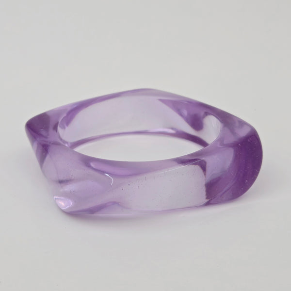 shiny irregularly square shaped resin bangle in a vibrant shade of light purple