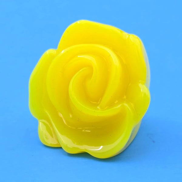 neon yellow resin rose ring on blue background