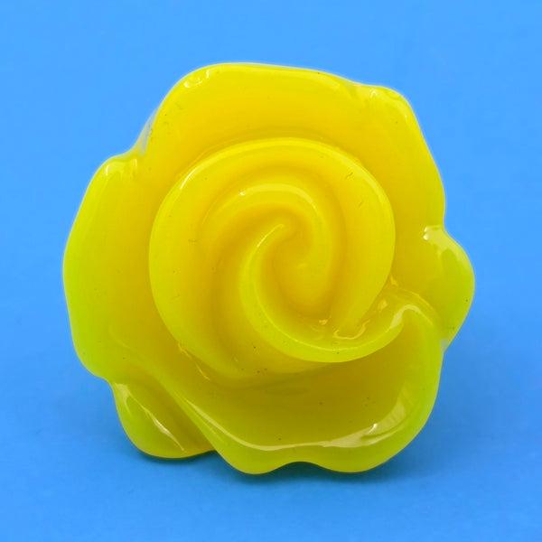 neon yellow resin rose ring on blue background
