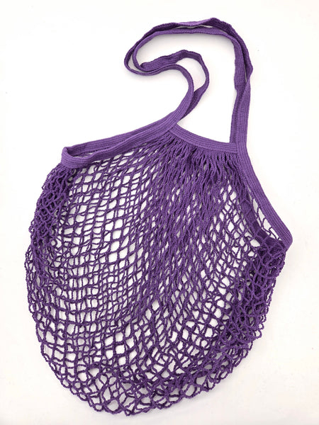Purple cotton mesh shopping bag on a white background