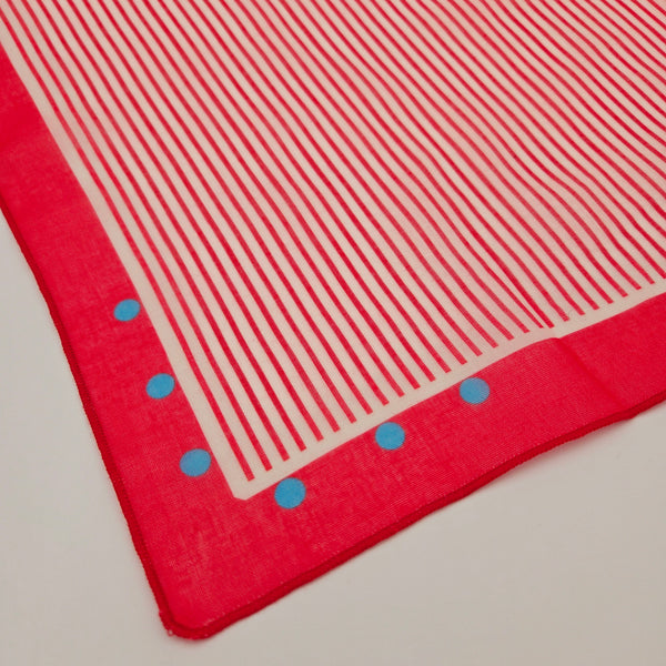 close up corner of white and red railroad stripe cotton blend square scarf with blue polka dot & red border 