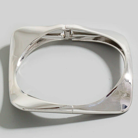 square shaped silver metal bangle with hinge closure
