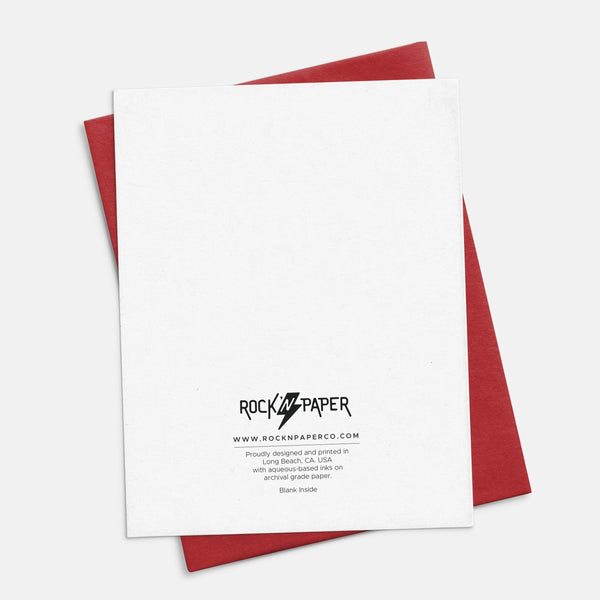 Greeting card with 'Love Struck' design in flames with match head on a pink background. Shown from back with matching red envelope 