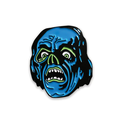 stylized rendering of Lon Chaney as Phantom of the Opera on a black & neon blue and green enameled pin with matte and shiny finish