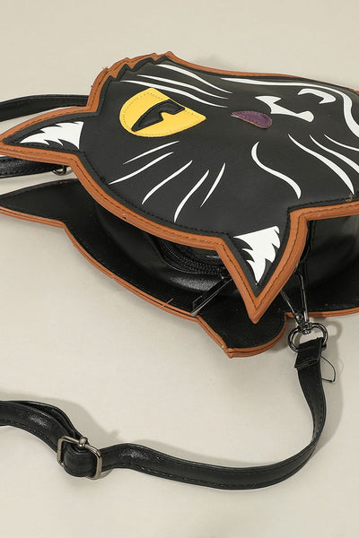 winking black cat-shaped cross-body purse. 