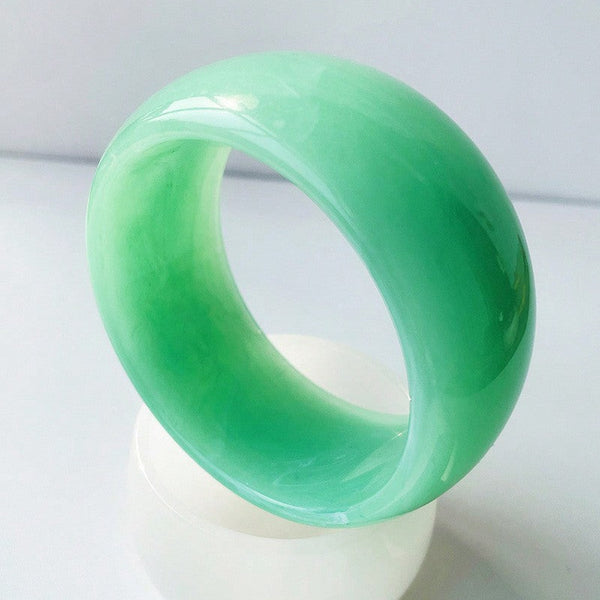 wide jade green resin bangle with subtle green and white marbling