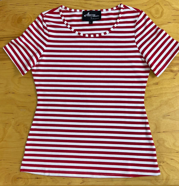 Red and white striped short sleeve cotton shirt with round neckline on a wooden surface