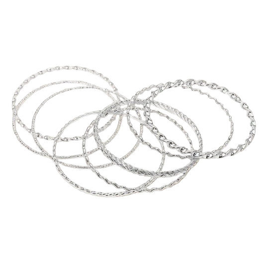 set of eight various textured wavy and twisted silver metal bangles shown scattered