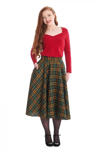 forest green, mustard, red, and black "Highland" plaid 50s style swing skirt, shown waist down on model wearing it with a red top