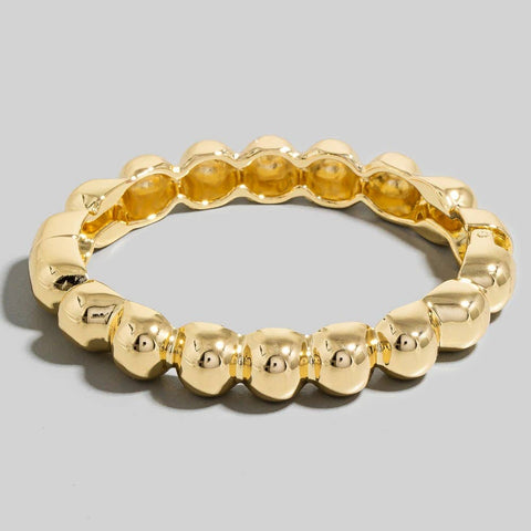 gold metal hinged bangle with a faux bead shape