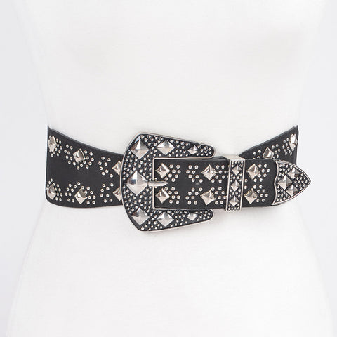 black faux leather elastic waist belt with small round silver studs and large pyramid studs & matching enameled black buckle and end tip. Shown from the front on a dress form