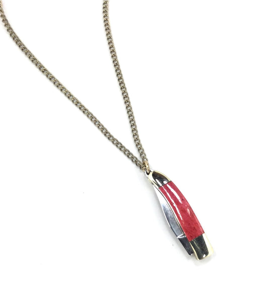 28” brass link style chain necklace with a mini stainless steel and brass pocket knife pendant with a red marbled finish handle. Shown with knife closed 