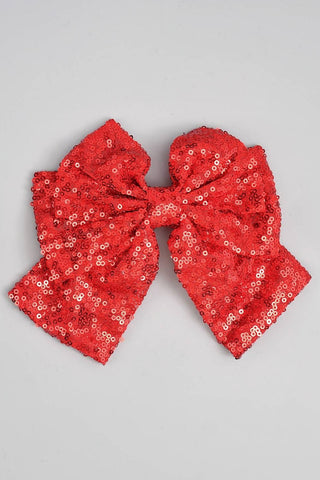 oversized red hair bow covered in matching red sewn on sequins