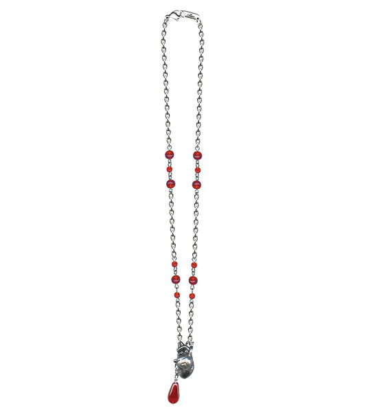 Necklace with a pewter anatomical heart pendant and red glass beads, including drop of blood shaped bead attached to heart charm on a white background