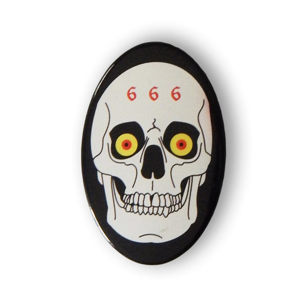 oval shaped metal 2.75" pinback button of silver metallic skull with red and yellow eyes and "666" written across its forehead on black background. Shown from front