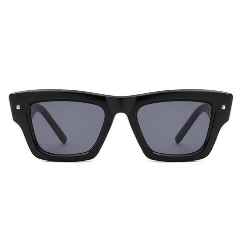 thick framed black wayfarer style sunglasses with silver square stud detail at each temple and arm with black smoke lenses. Shown from front