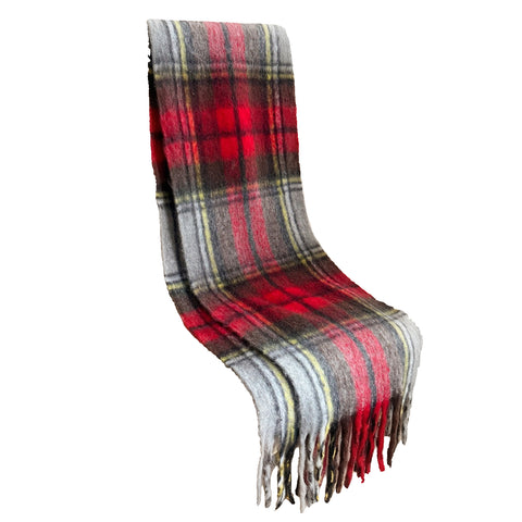 red, yellow, black, and white plaid fuzzy scarf with fringe shown folded flat