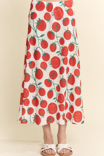 model wearing silk weave midi skirt with elastic waistband and off-white background sketch style red and green tomato pattern. Shown from front in close up