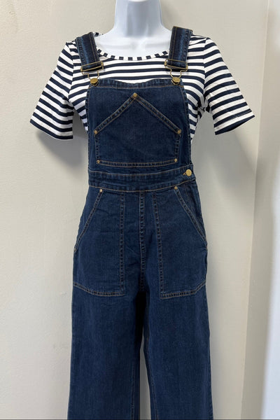 dark wash 1950s style reproduction denim overalls with pentagon-shaped bib pocket, brass buttons at hips, deep front and back pockets shown on dress form with striped t-shirt