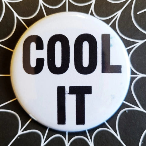 2.25” pinback button with “COOL IT” written in black on white background 