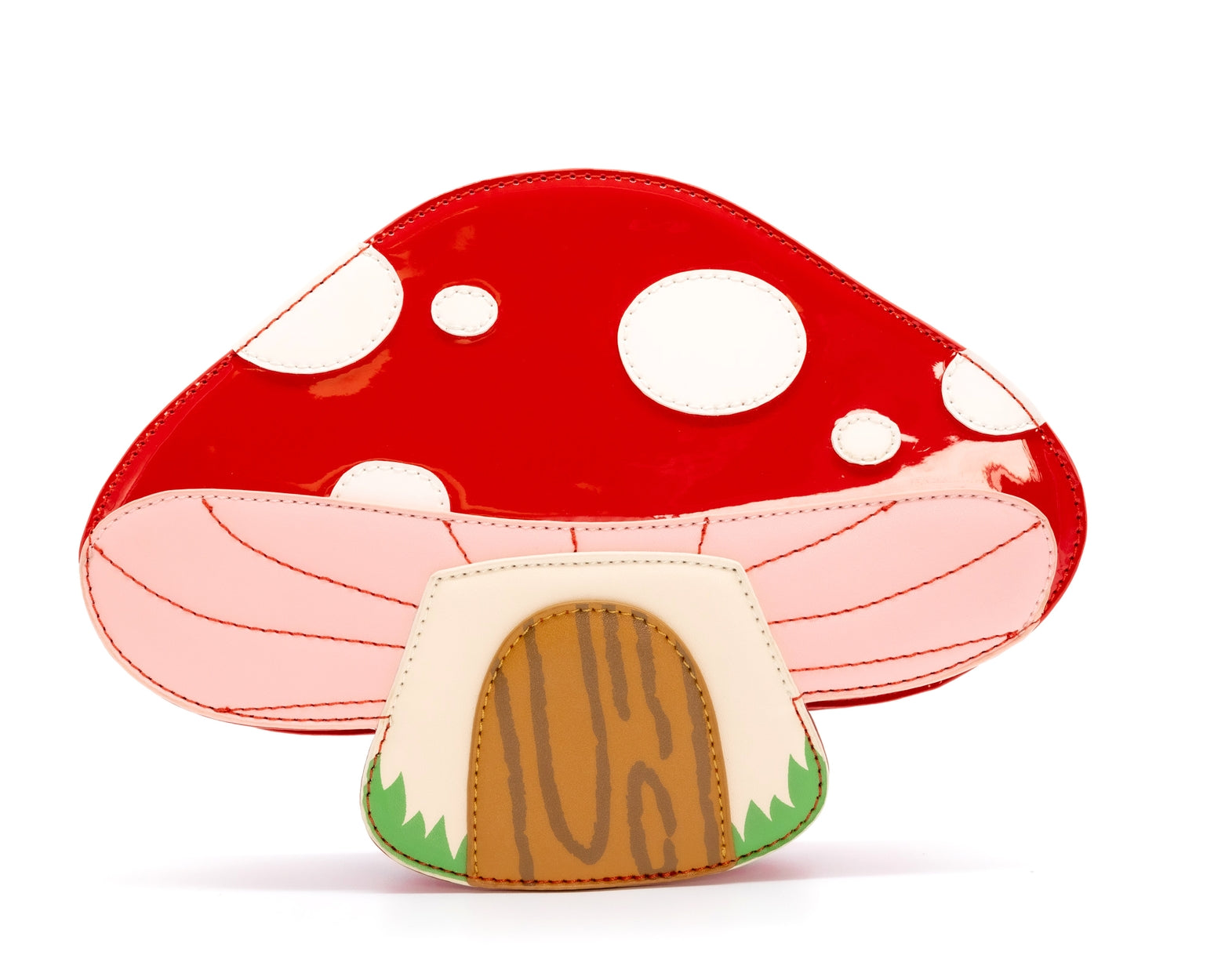 red and white spotted toadstool mushroom house with wooden door shaped purse