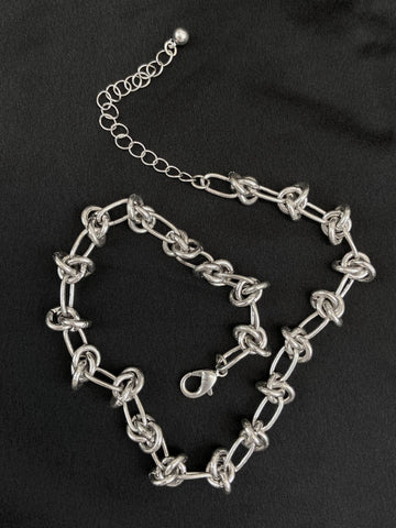 Linked chain necklace in style of barbed wire with lobster clasp closure and extender